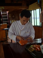 Chef creating a net made of carrot