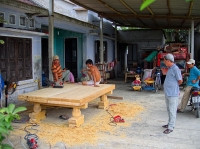 Workmen building a bed